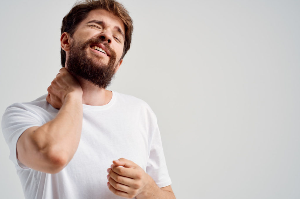beard man wearing white shirt suffer from neck pain